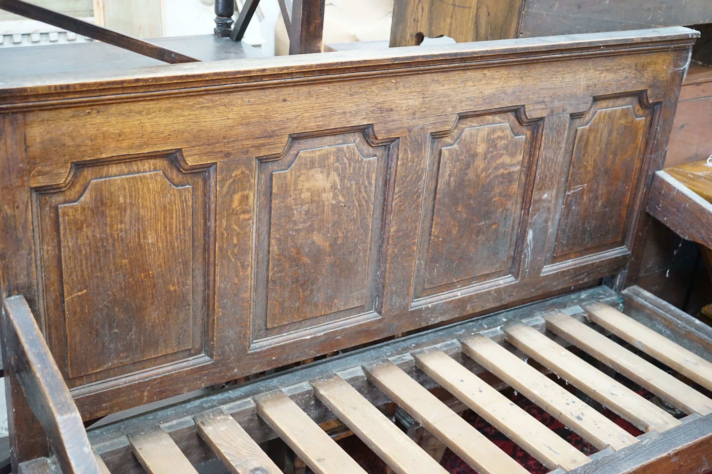 A George III oak settle, length 148cm, depth 60cm, height 106cm